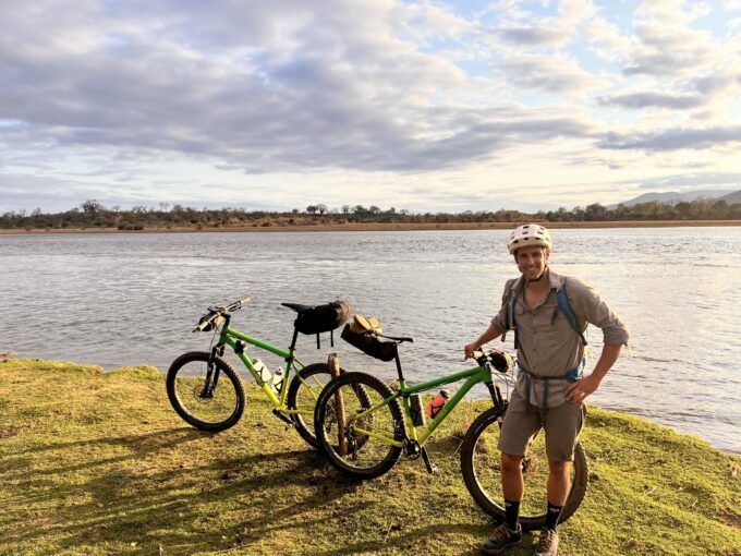 Scenic river with bicycles and guide while Bikepacking the Lower Zambezi river
