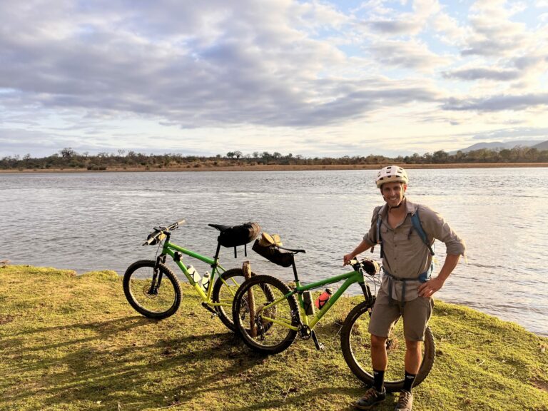 Scenic river with bicycles and guide while Bikepacking the Lower Zambezi river